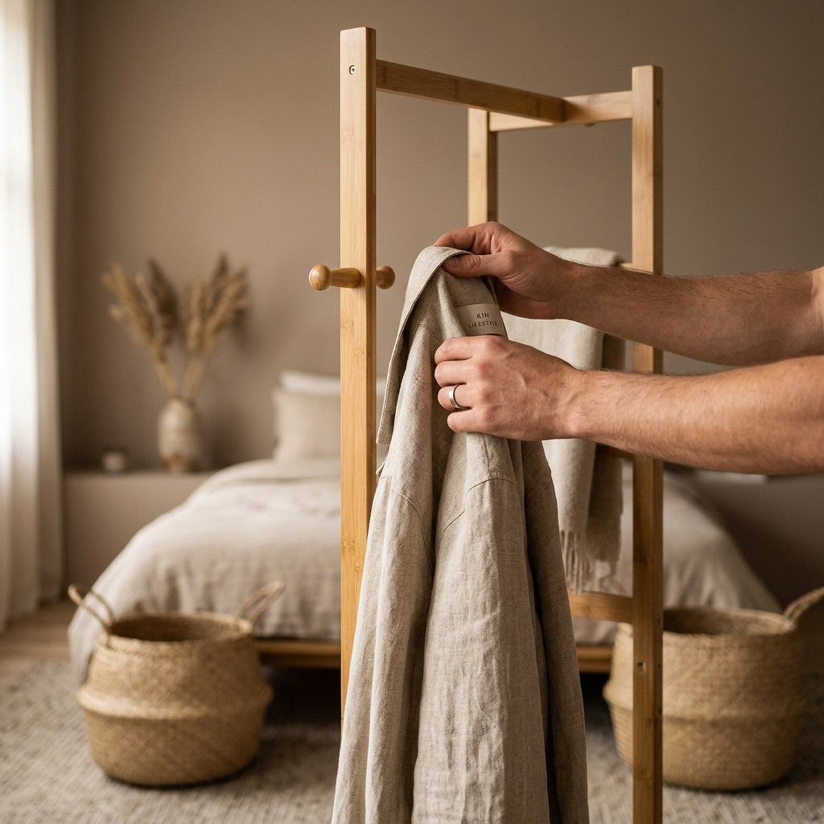 slim bamboo garment rack with two storage shelves